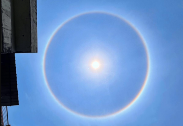 Photos of ultra-rare occurrences show ethereal “halo” and light arcs surrounding the sun 2023